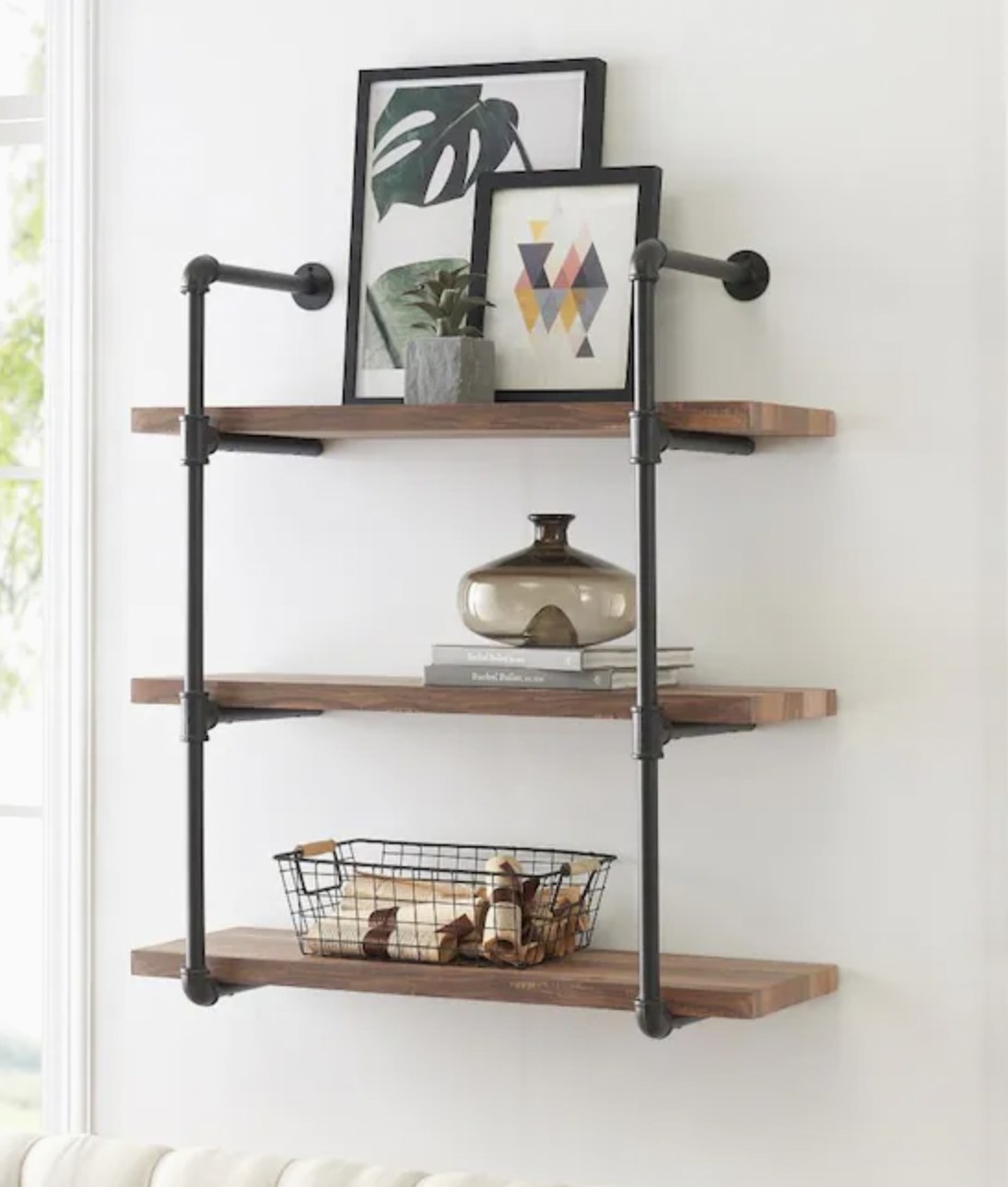 a wood and metal shelving unit with two metal rods and three wooden shelves