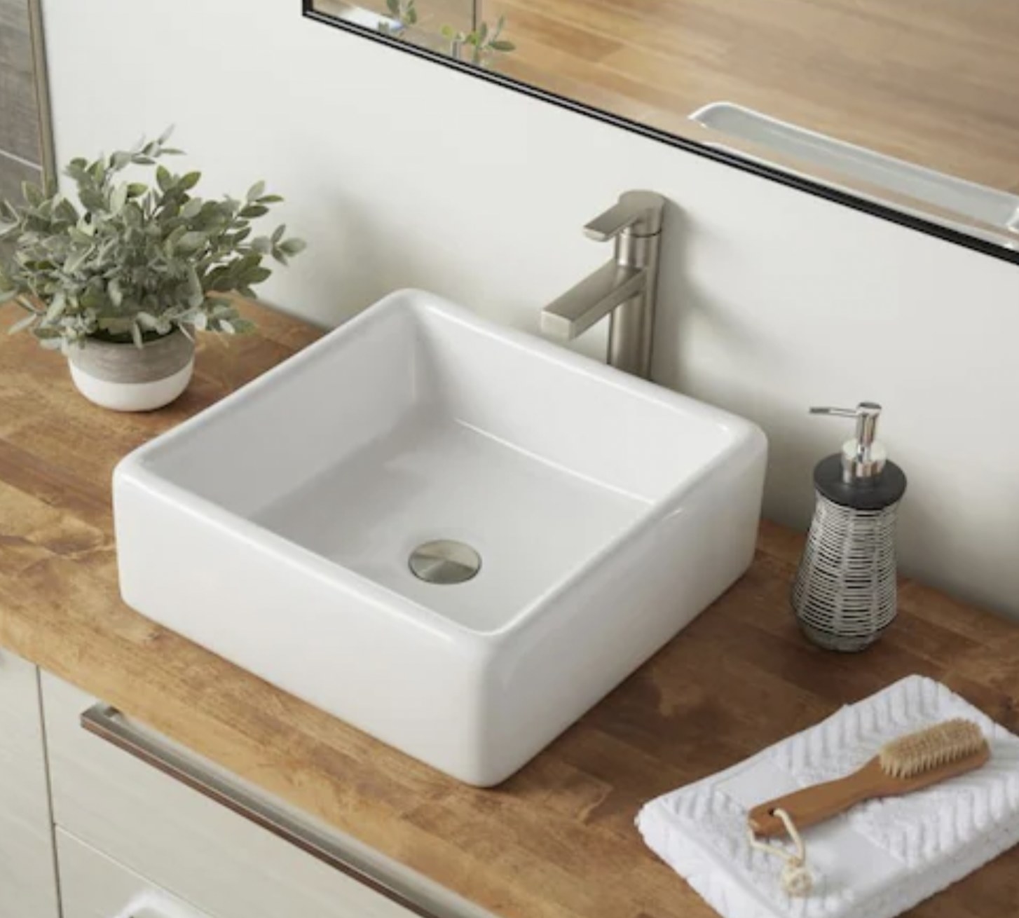 a square vessel sink in a bathroom