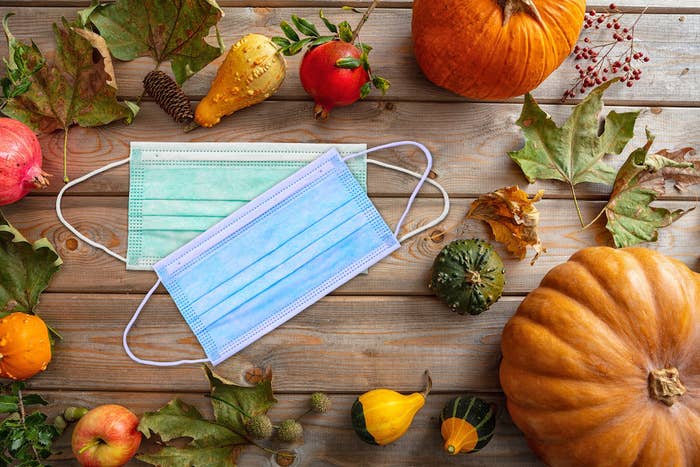 Surgical masks on a table decorated for fall