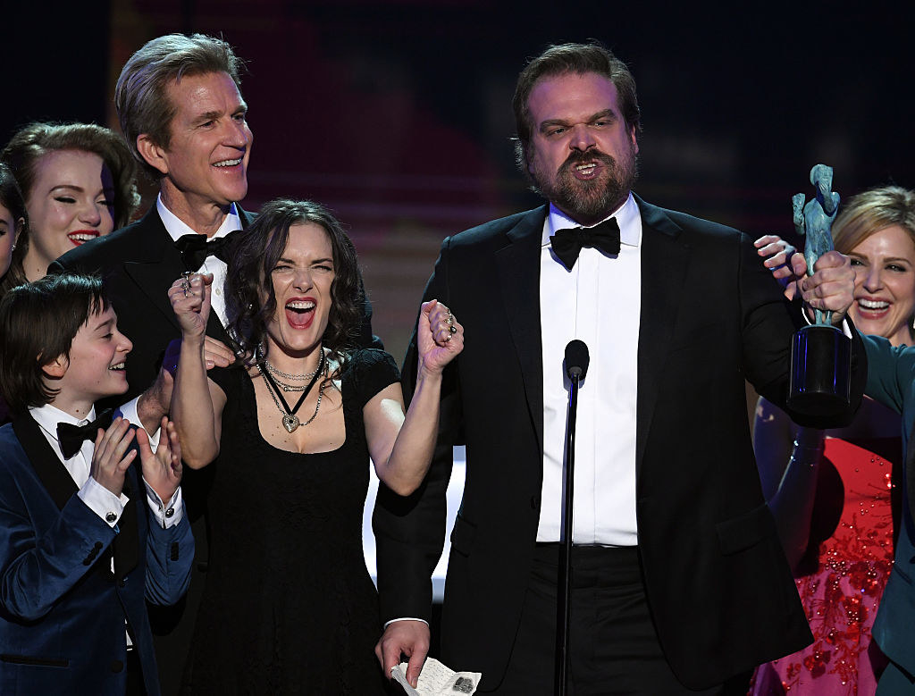 Winona Ryder and David Harbour accept an award for Stranger Things