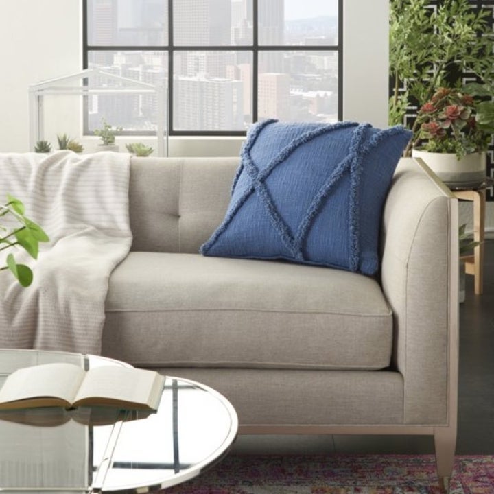 The same decorative throw pillow in blue