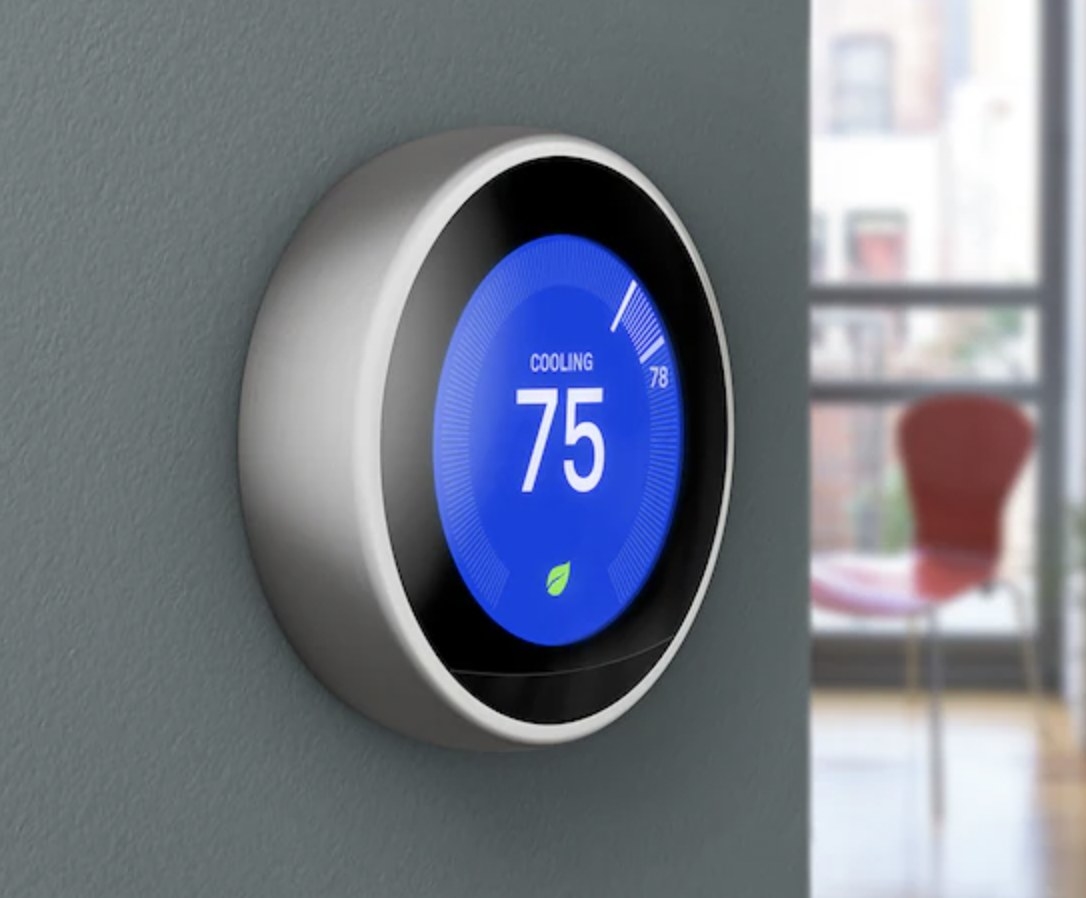 a google nest thermometer on a wall