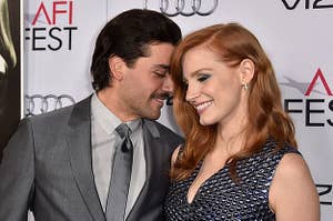 Oscar Isaac (L) and Jessica Chastain attend AFI FEST 2014 presented by Audi opening night gala premiere of A24's "A Most Violent Year"