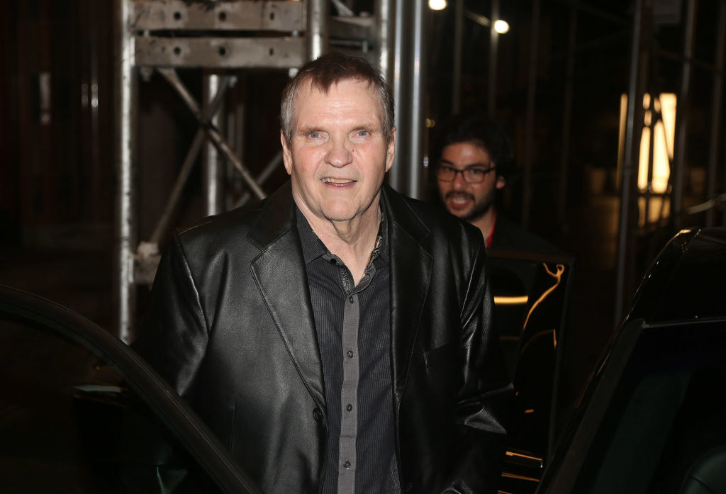 Meat Loaf wearing a black leather jacket