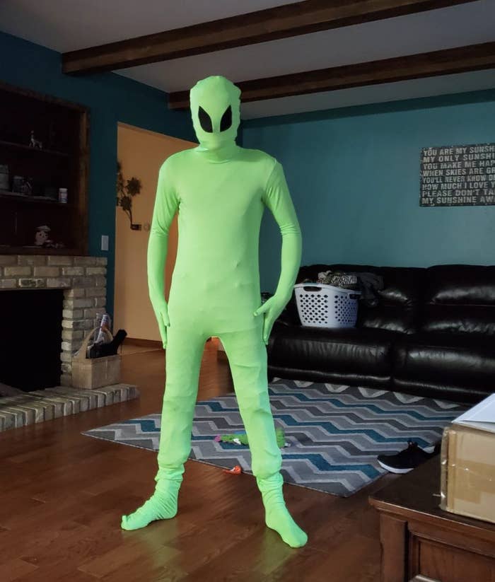 reviewer wearing the alien costume