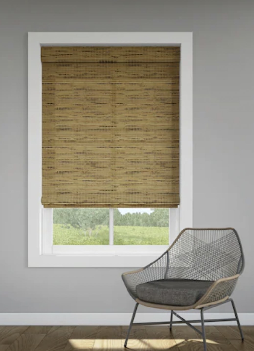a roman shade in brown on a window