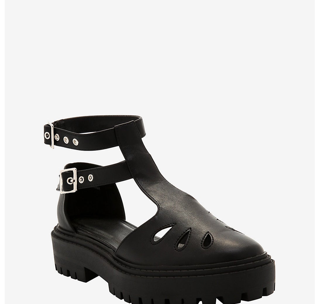 The double buckled t-strap mary jane shoes in black, with a leaf-like design on the top