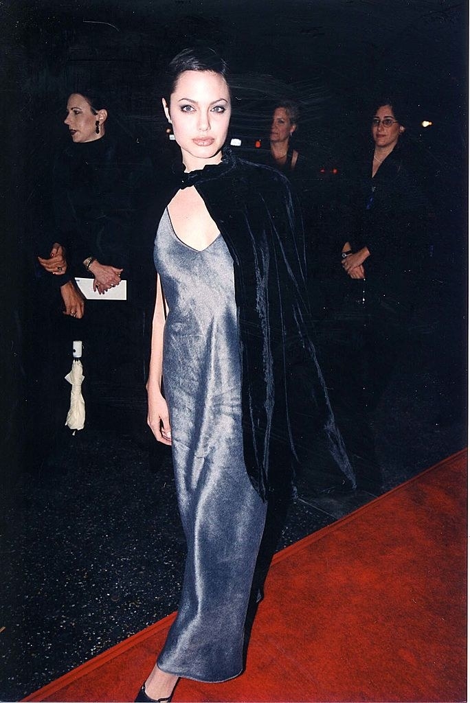 with a cape on a red carpet