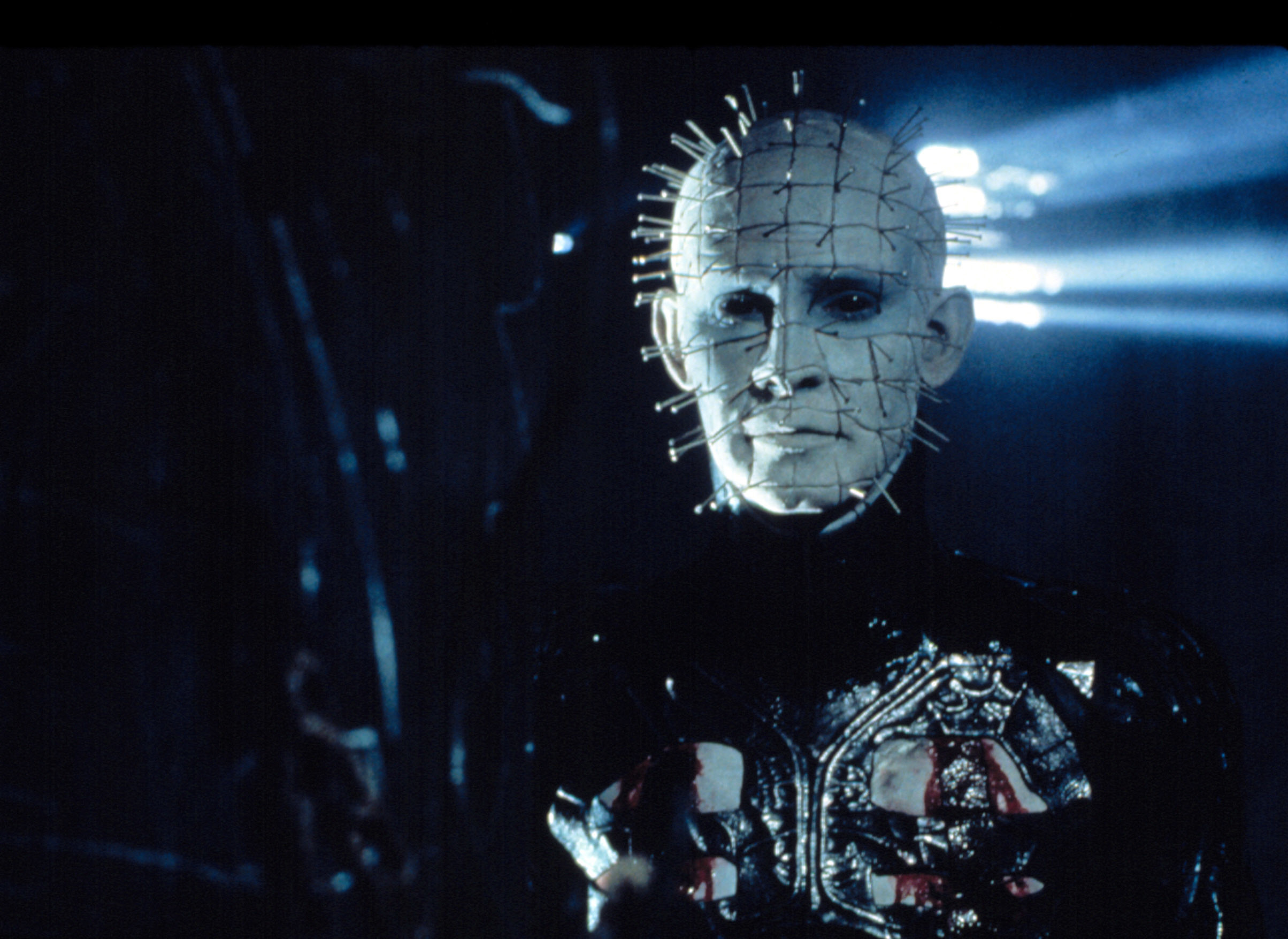 Pinhead staring and covered in blood.
