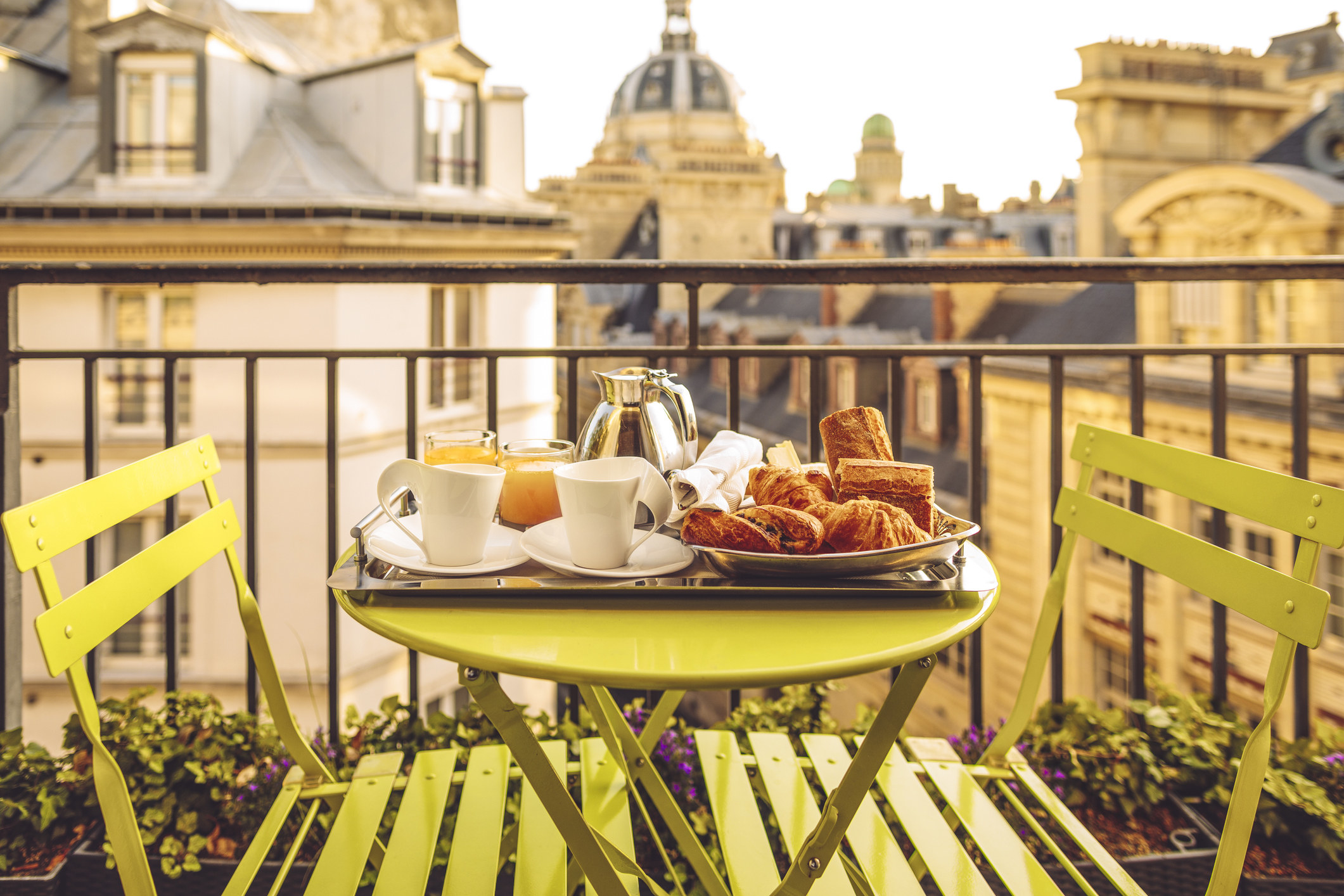 A hotel breakfast on a balcony in Paris.