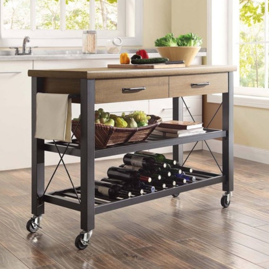 A metal/wood kitchen island on wheels with two drawers and two shelves
