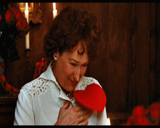 A gif of Meryl Streep in Julie and Julie moving a paper heart on her chest to look like it&#x27;s beating