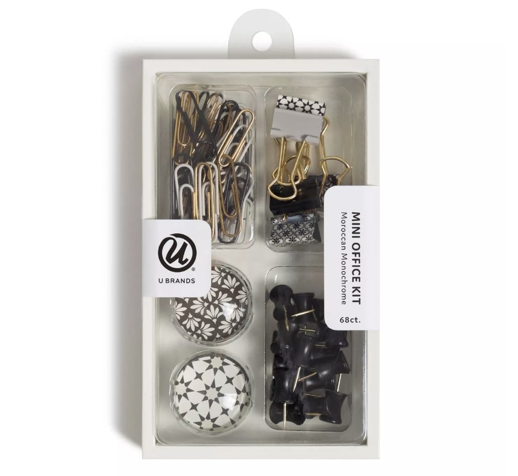 Office accessories clip with black, white, gold paper clips, binder clips, two magnets and black thumb tacks