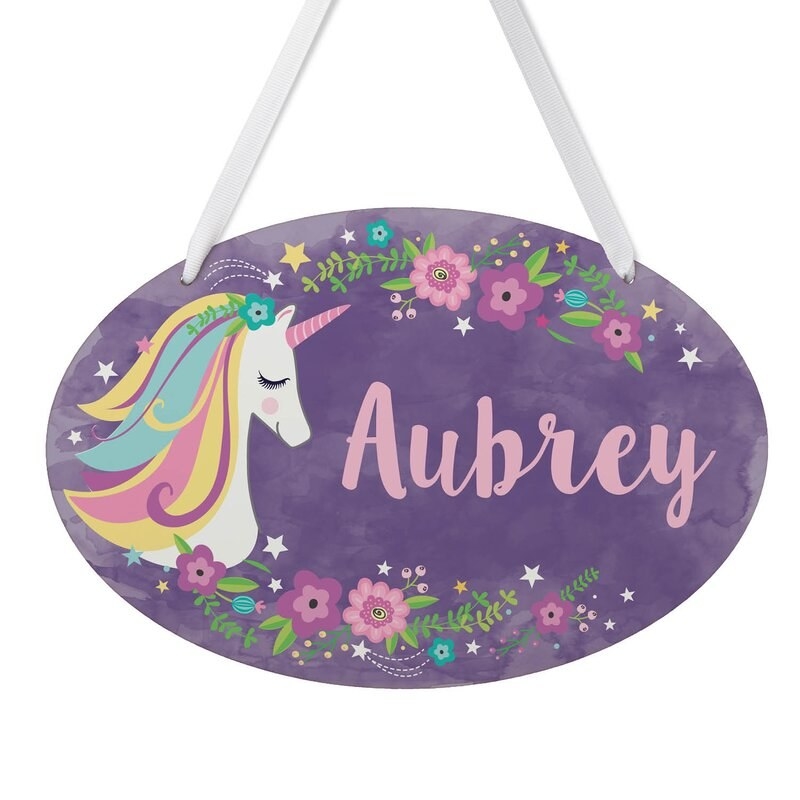A personalized unicorn door sign with Aubrey printed on it