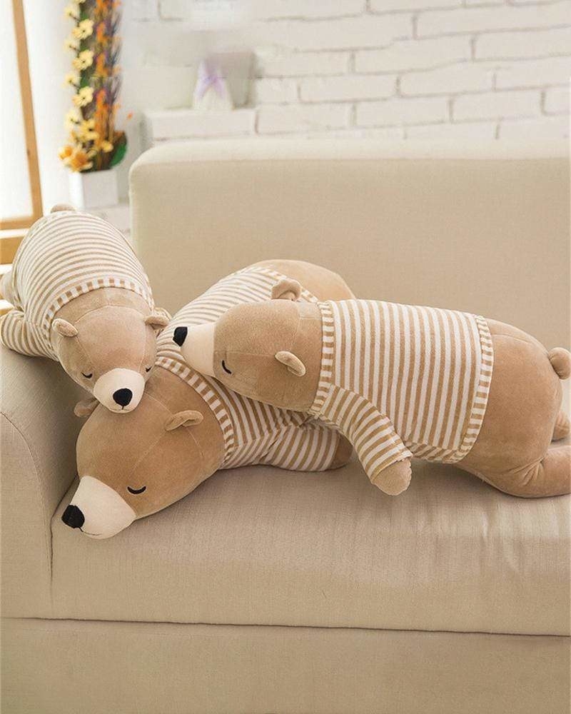 Three bear-shaped pillows on a couch