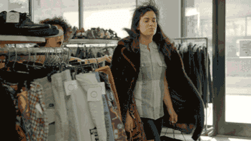GIF of Abbi and Ilana from &quot;Broad City&quot; walking out of a store with shopping bags