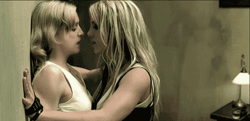 Britney and Madonna at the end of their &quot;Me Against the Music&quot; music video, almost kissing, Madonna disappearing