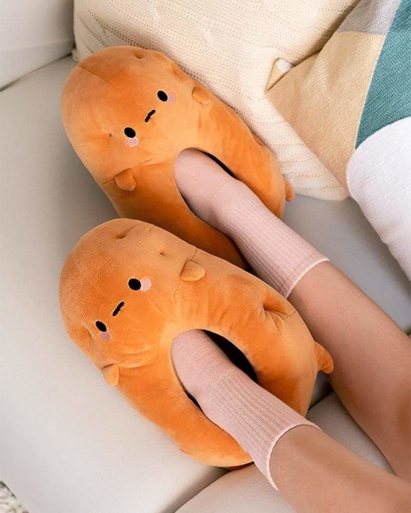 A person wearing gigantic plush slippers