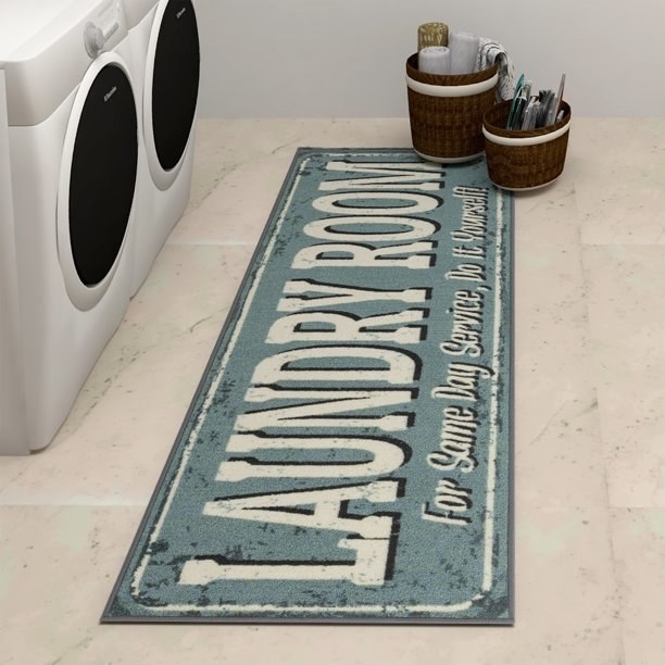 The blue and white runner that says &quot;Laundry Room For Same Day Service, Do It Yourself&quot;