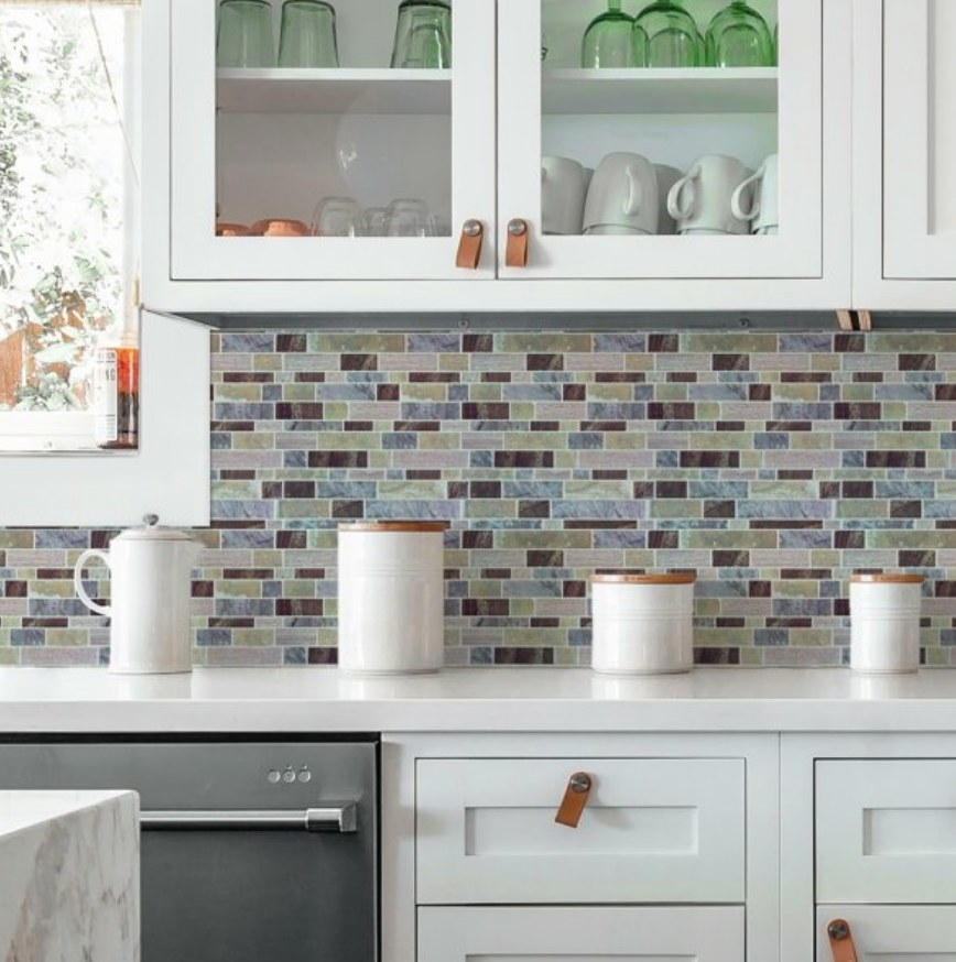 Blue/cream/brown/green tile peel and stick backsplash in a kitchen