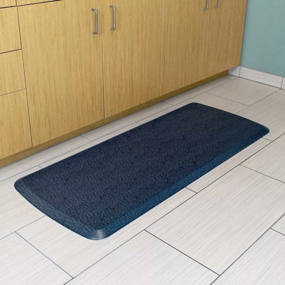 Blue comfort mat on floor