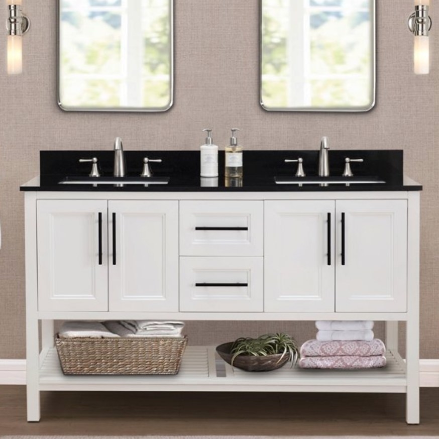 A double sink white vanity with black door handles and counter