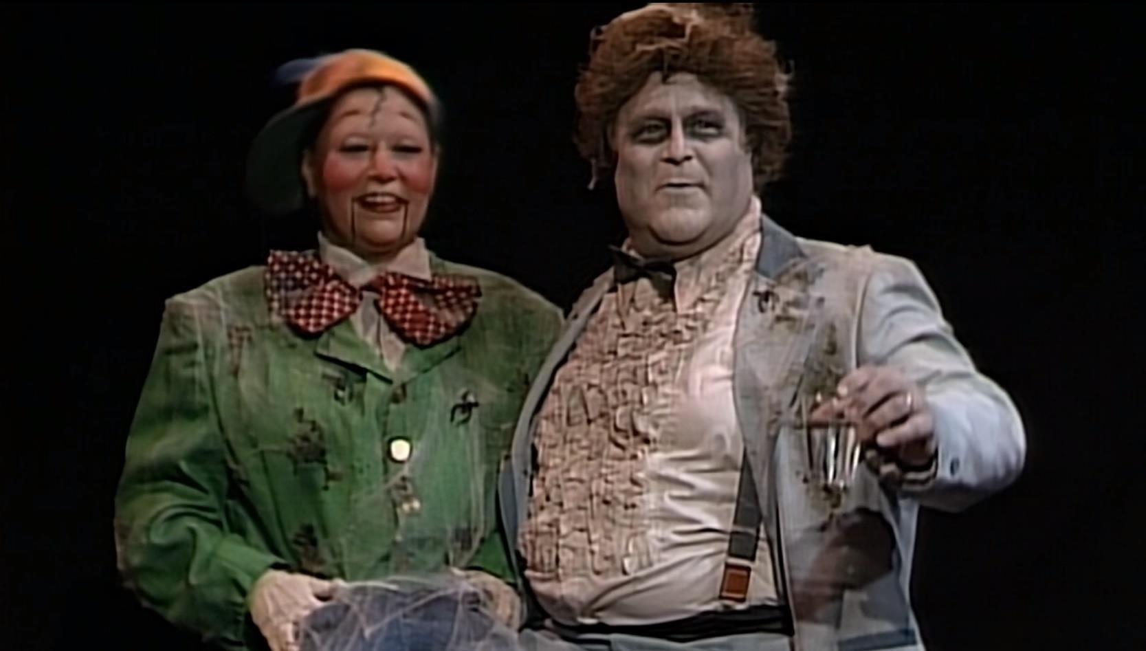 Roseanne dressed as a dummy and Dan dressed as an undead ventriloquist.
