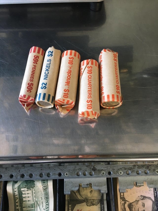 Five rolls of coins, nicely wrapped in bank paper