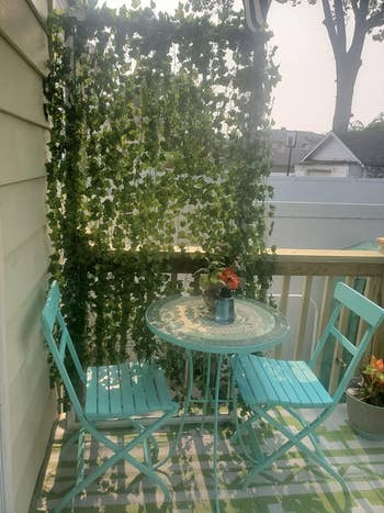 reviewer using the ivy on their balcony as a privacy divider