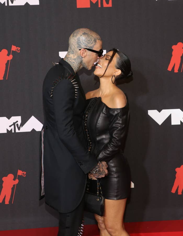 Travis and Kourtney kiss on the red carpet
