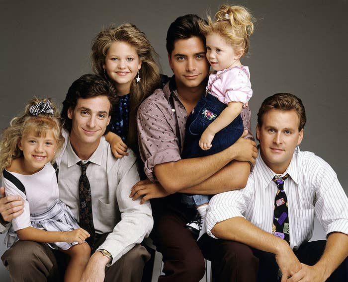 The cast of Full House, including Jodie Sweetin (Stephanie), Bob Saget (Danny), Candace Cameron (D.J.), John Stamos (Jesse), Mary Kate/Ashley Olsen (Michelle), Dave Coulier (Joey)