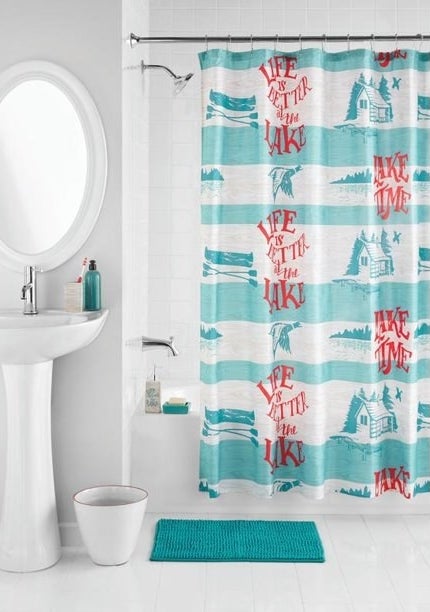 Bathroom shower curtain, rug, soap dish, and toothbrush holder