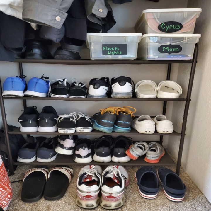 shoe rack lined up with various sized shoes