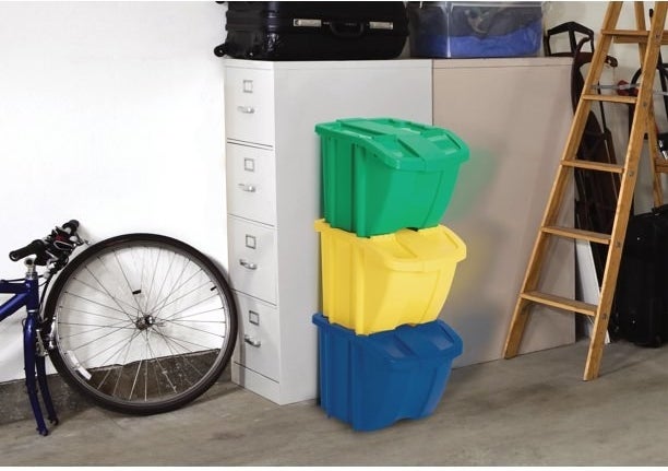 three bins stacked on top of each other in a garage