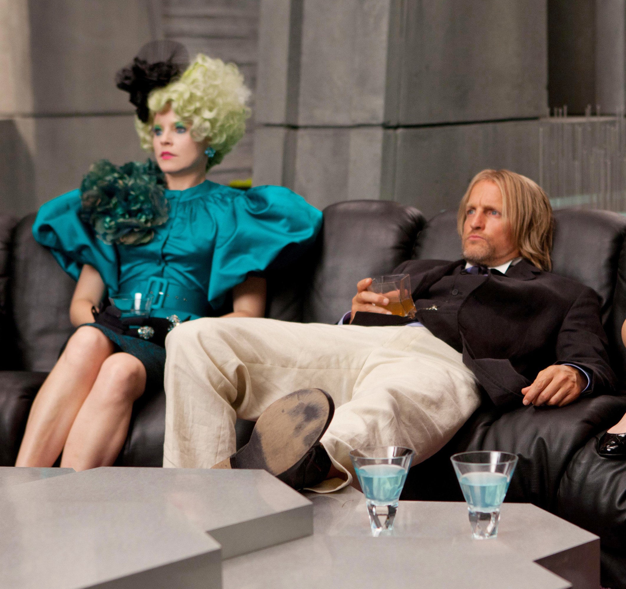 Effie and Haymitch watch TV in The Hunger Games