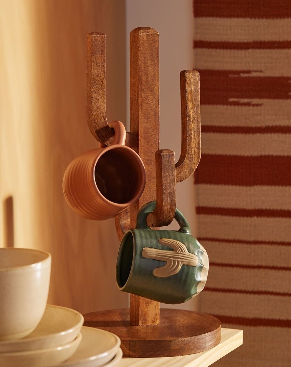 the cactus mug tree with mugs on two of its three arms