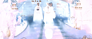GIF of three people standing in halloween costumes