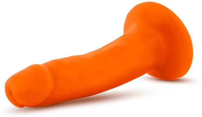 Orange dildo with suction cup base