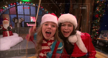&quot;iCarly&quot; characters wearing Santa hats under fake snow