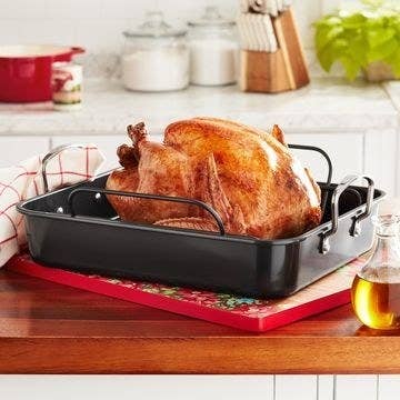 The roaster with a roasted turkey