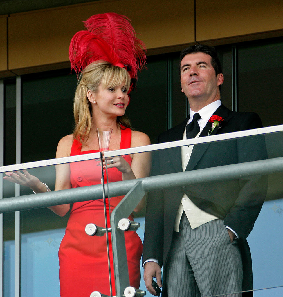 Amanda Holden and Simon Cowell in formalwear at an event