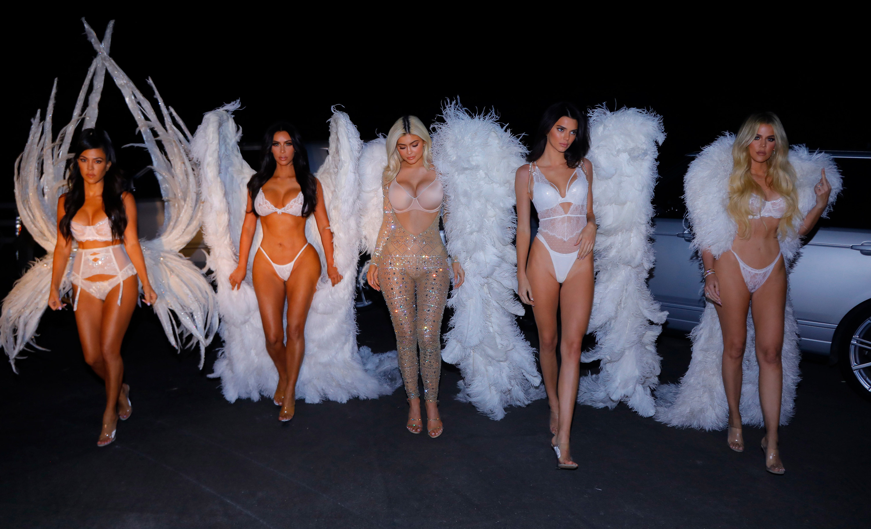 Kourtney, Kim, and Khloe Kardashain with Kendall and Kylie Jenner dressed as Victoria Secret Angels
