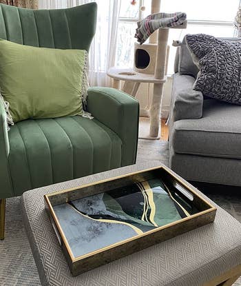 Reviewer photo of the green and gold tray in a living room