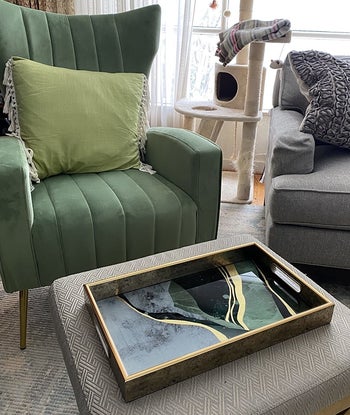 Reviewer photo of the green and gold tray in a living room