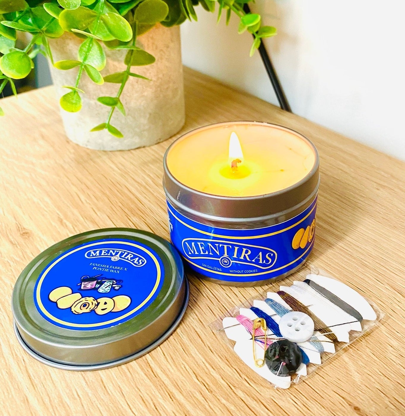 The sugar cookie candle and the included mini sewing kit
