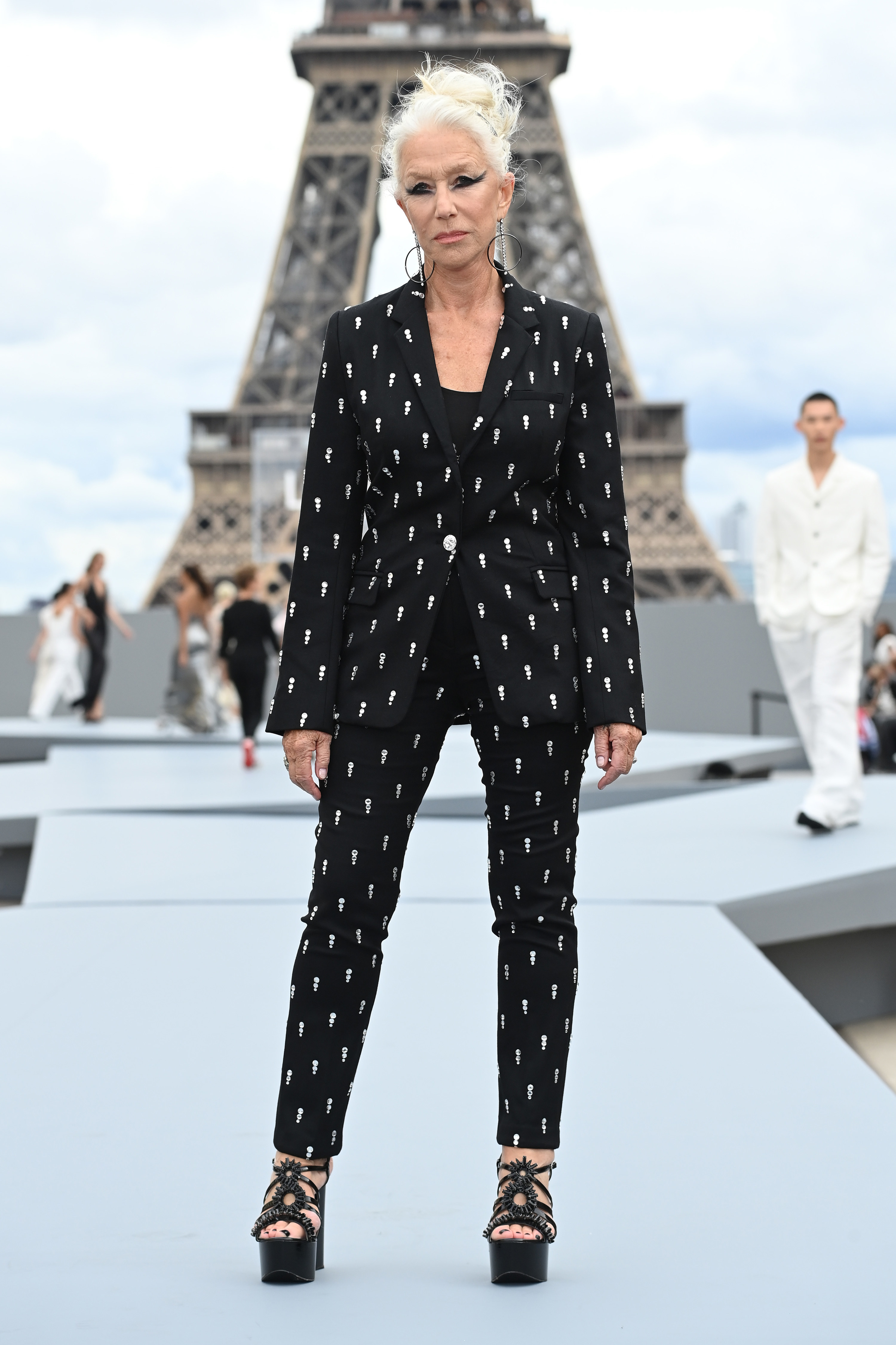 Walking in a fashion show in Paris with the Eiffel Tower in the background