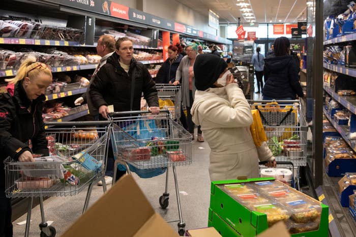 People in a packed grocery store
