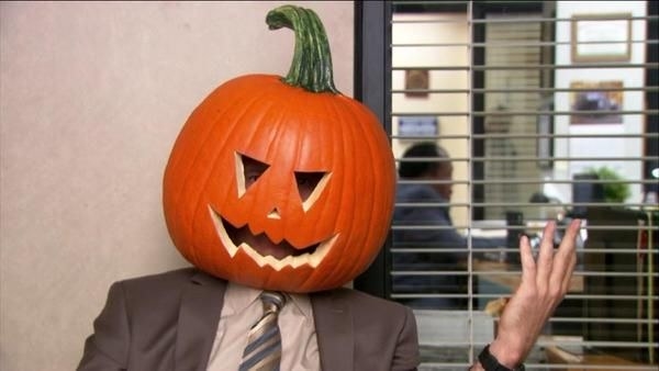 Dwight wears a real jack-o-lantern on his head.
