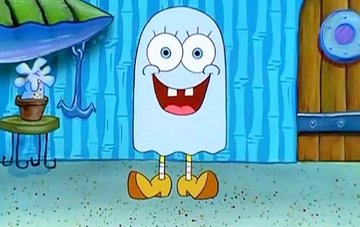 SpongeBob wears wooden shoes and a sheet over his rounded head.