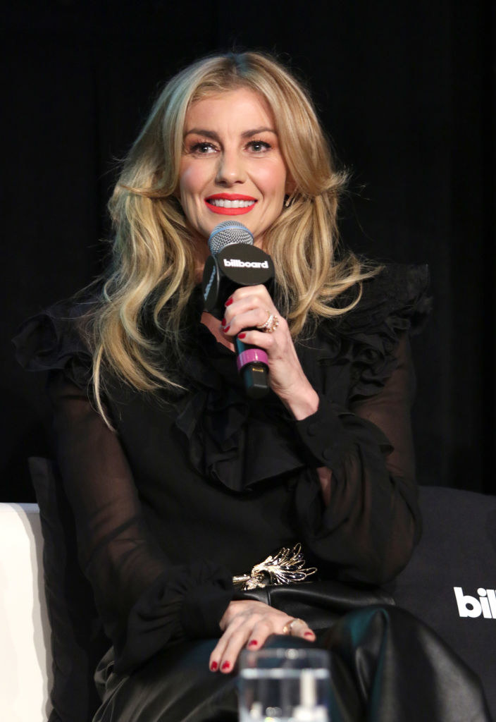 Faith Hill speaking on stage at an event